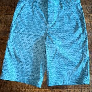 Boys size 16. The brand is Under armour and are in excellent condition.